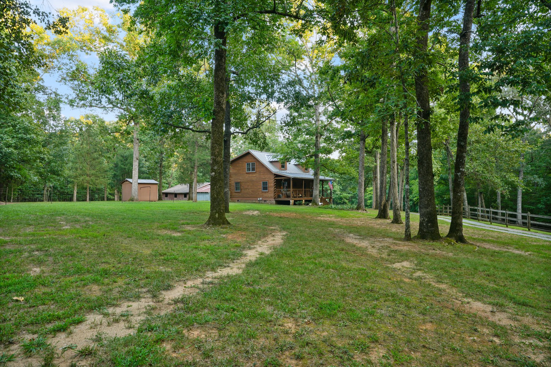 Open mown ground running back under mature hardwoods